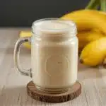 Banana Caramel Kefir Smoothie: The Best 1-Minute Gut-Healing Recipe 6 Banana Caramel Kefir Smoothie in a glass with caramel drizzle